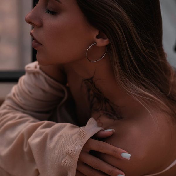 Calm woman with eyes closed in a peaceful state of relaxation.